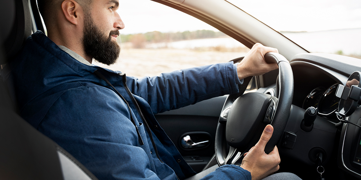 Corporate driver practicing hazard awareness during defensive driving training in Saudi Arabia